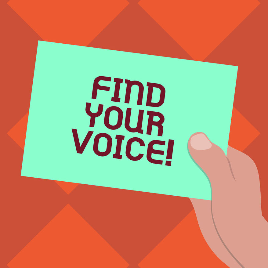 hand holding card that reads find your voice
